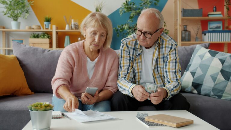 senior couple counting cash of their required minimum distribution